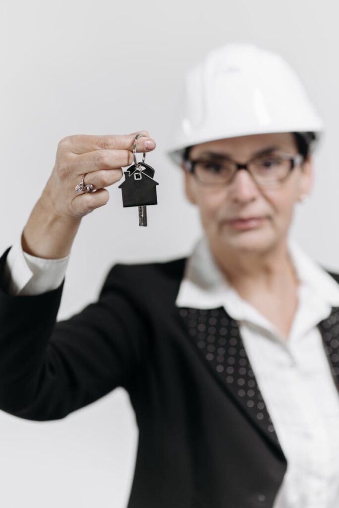 Real Estate Agent with Key on Hand