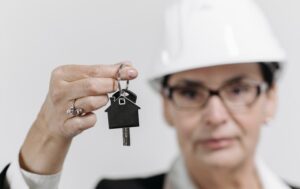 Real Estate Agent with Key on Hand